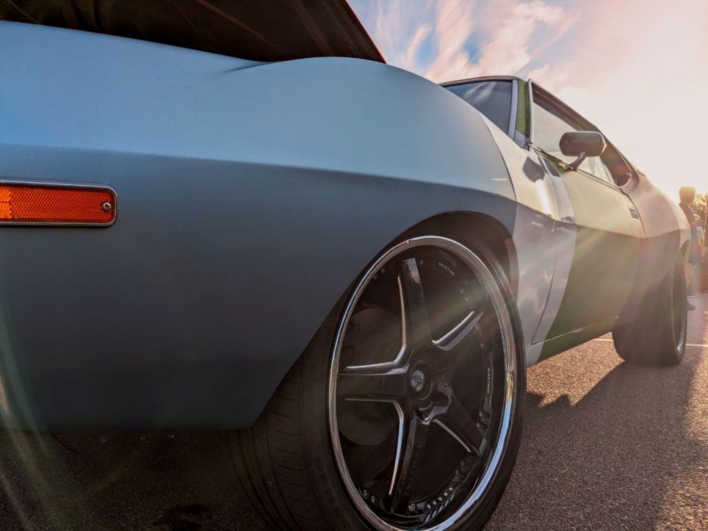Rainbow-like sunrays surround an AMC Javelin