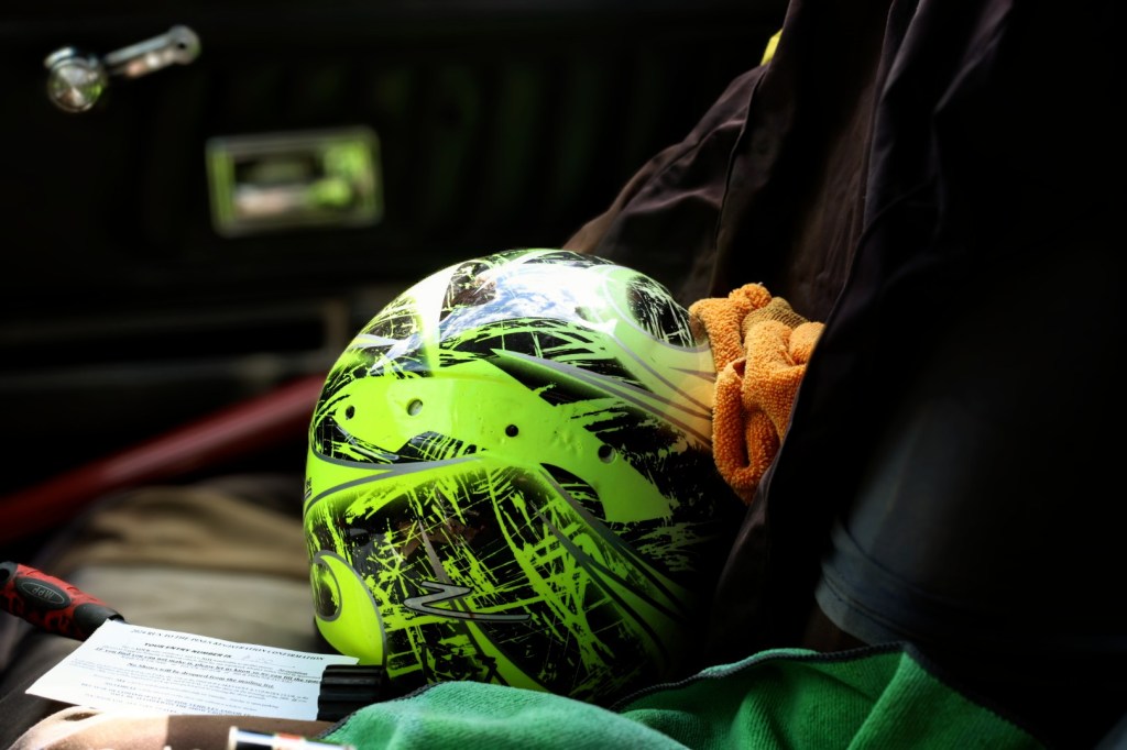 Close up shot of a helmet in a vintage racecar